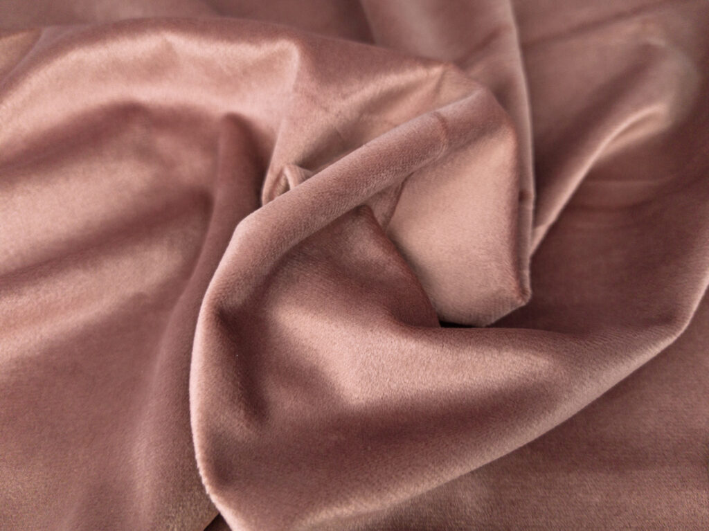 Stoffstruktur Samt antikrosa Nahaufnahme Polyester-Samt mit weicher Oberfläche